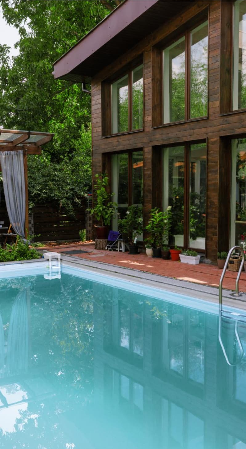 children and parent playing in pool