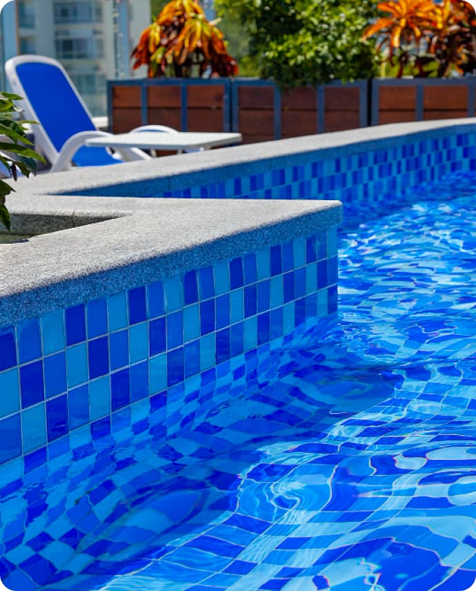 Pool with blue tiles and luscious clean water
