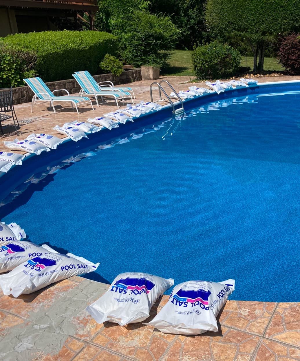 salt being poured into a pool