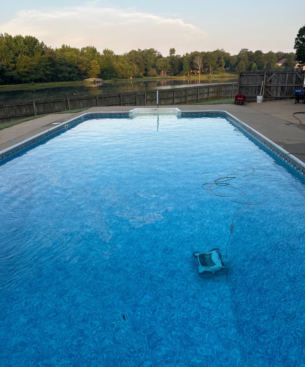 a pool being vacuumed